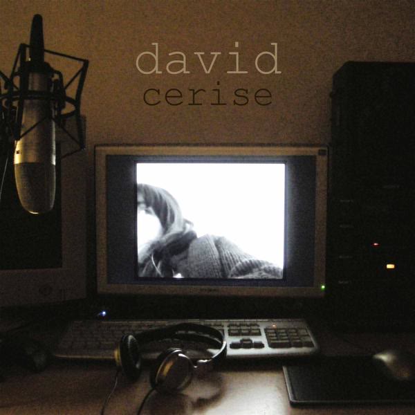 Cover of the album “cerise”: a home studio at night — a microphone, a glowing screen, headphones on the desk